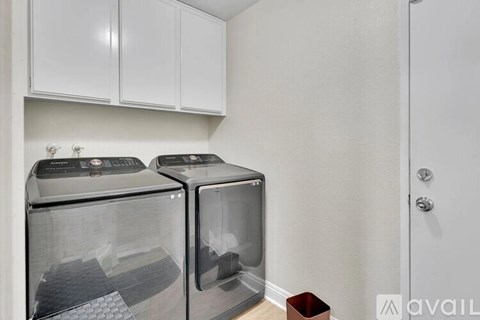 Two microwaves are sitting on a counter in a kitchen.