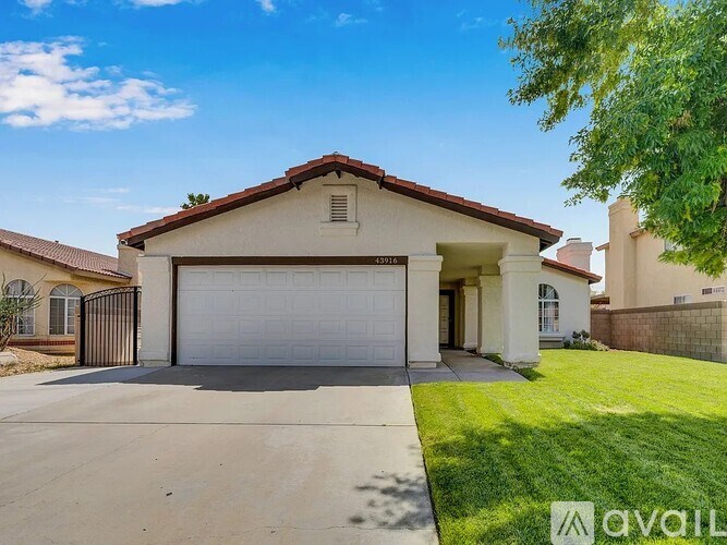 A house with a garage is for sale.