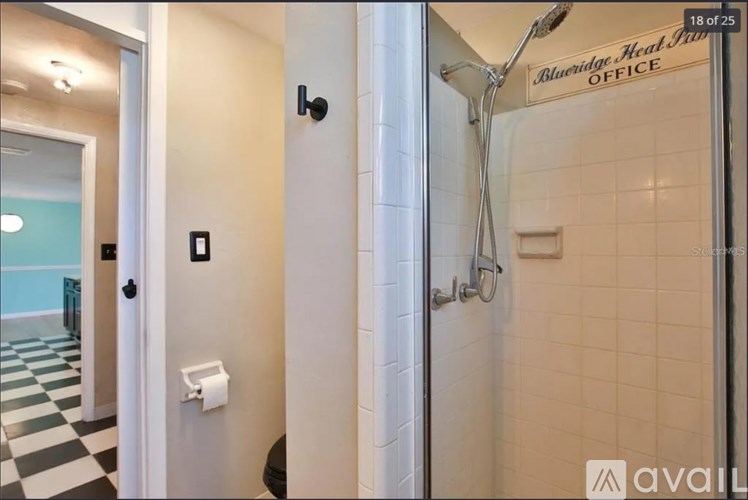 A bathroom with a sign that says "Alveridge Heal Office".