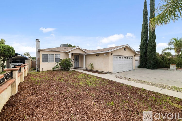 A house with a white garage door is for sale.
