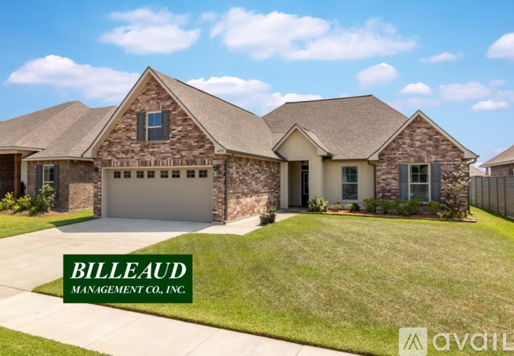 A house with the name Billeaud Management Co., Inc. on the front yard.