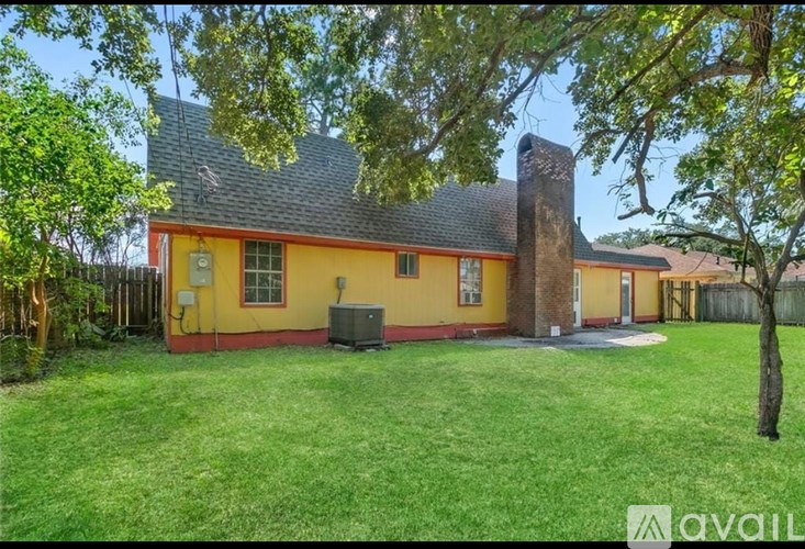 A house with a red and yellow exterior is for sale.