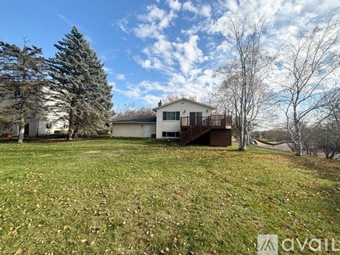 A house with a lawn in front of it is for sale.