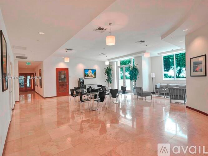 A spacious living room with a dining area and a television.