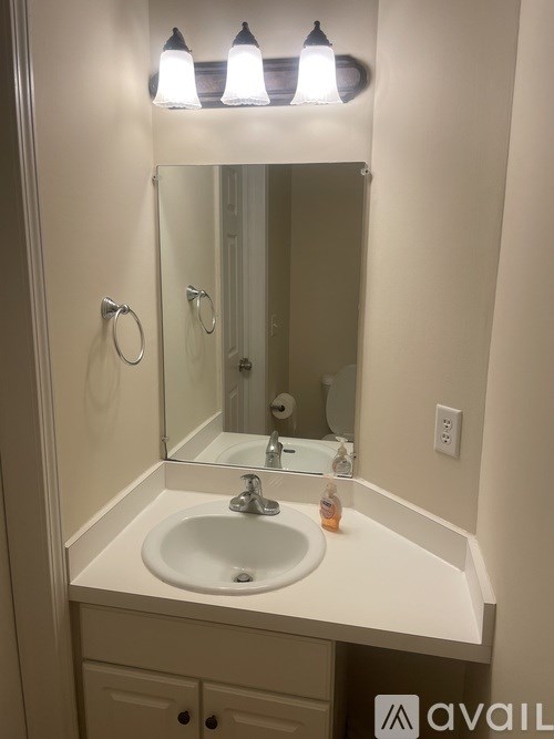 A bathroom sink with a mirror above it.