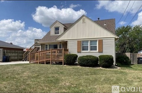 A house with a brown and white exterior is available for rent.