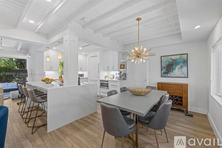 A modern dining room with a large table and chairs.