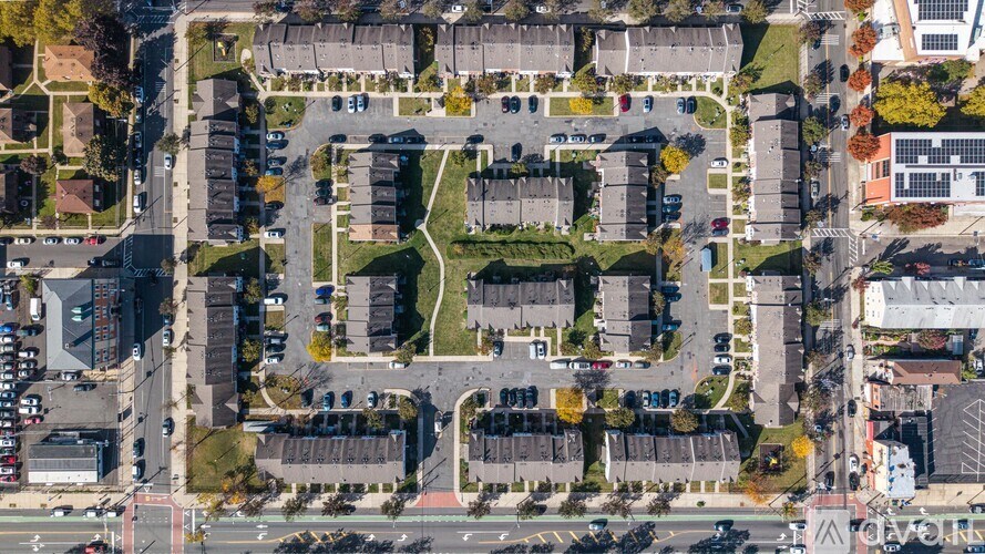 An aerial view of a parking lot surrounded by buildings.