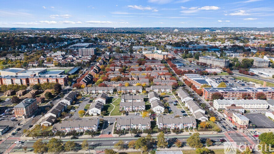 A bird's eye view of a residential area with houses and buildings.