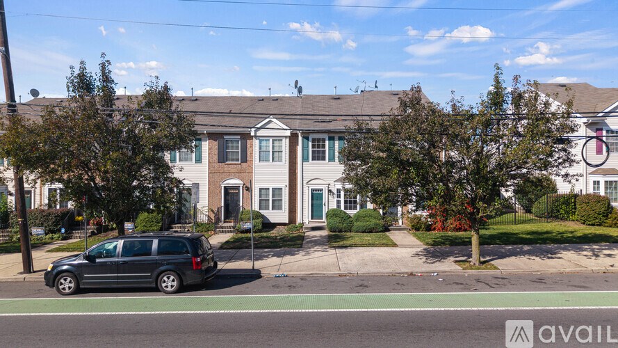 A house with a car parked in front of it.