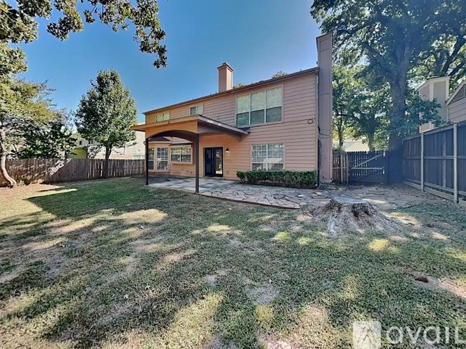 A house with a brown roof and a brown fence.