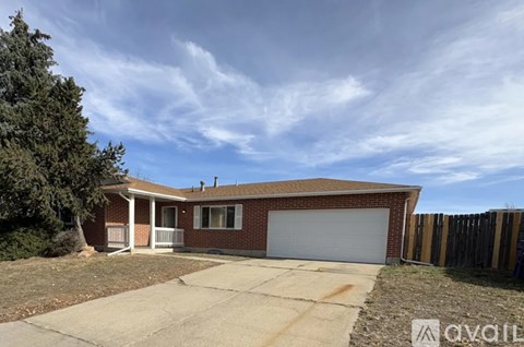 A house with a garage is for sale.