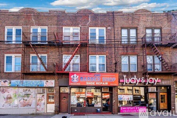 A brick building with a barber shop and beauty salon on the ground floor.