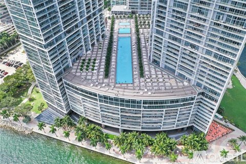 A large building with a pool in the middle of it.
