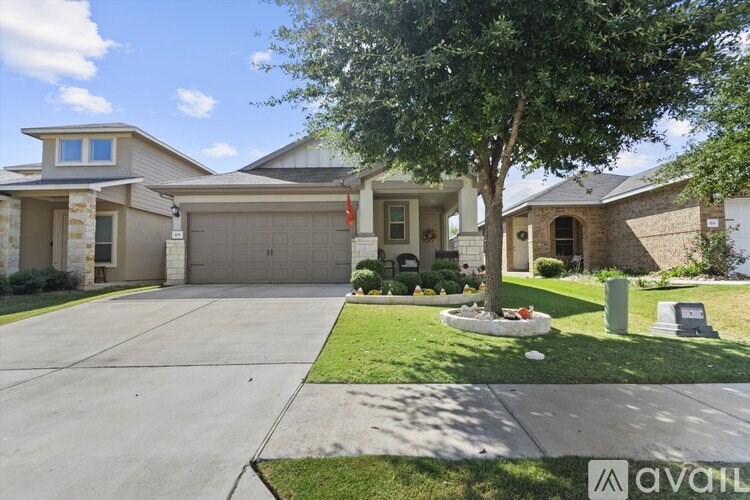 A house with a tree in front of it.