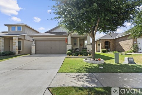 A house with a tree in front of it.