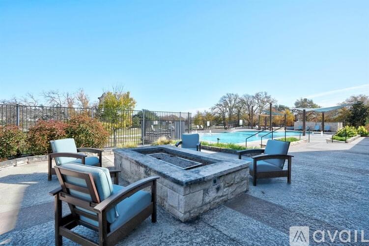 A patio with chairs and a table is available for rent.