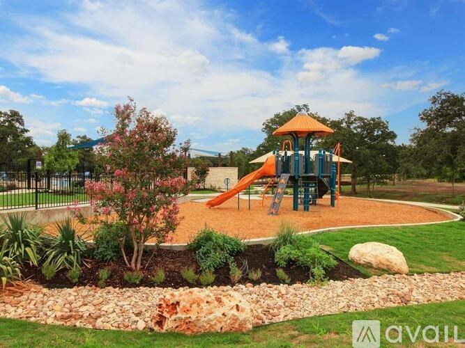 A playground with a slide and a swing set.
