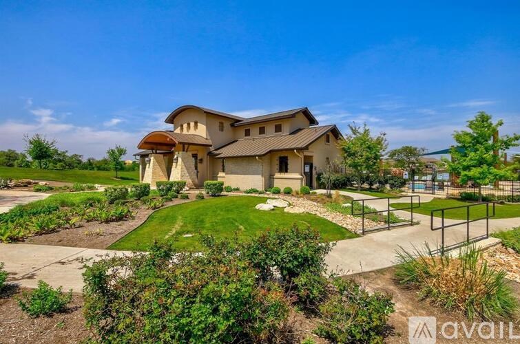 A large house with a garden in front is for sale.