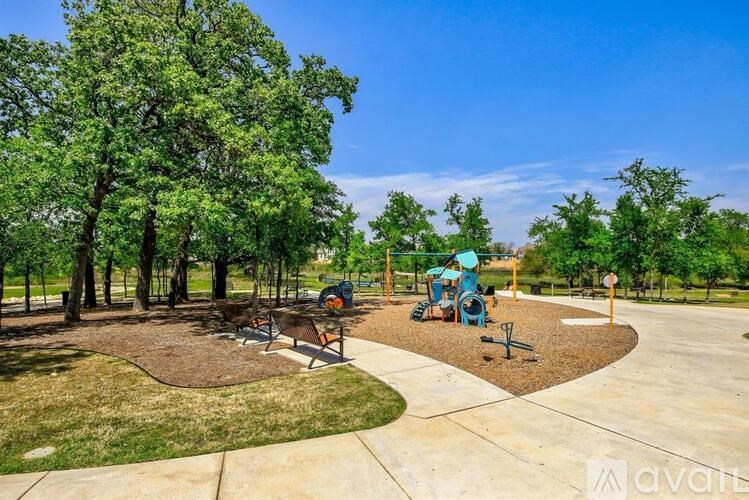 A playground with a swing set and a slide.