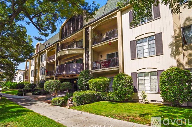A building with a balcony and a sign that says "The Chateau".