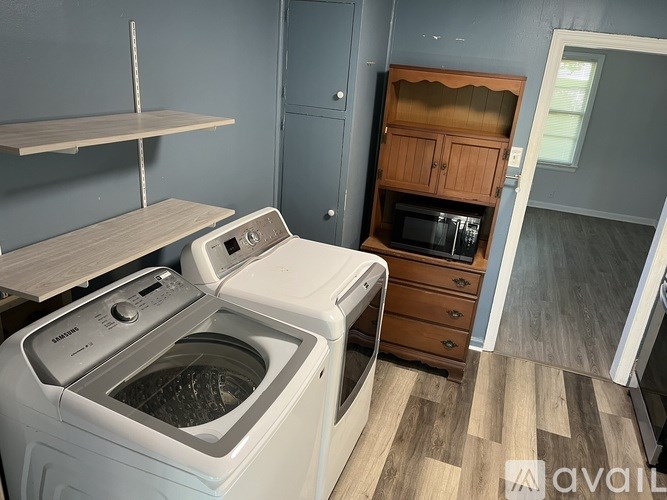 A laundry room with a washer and dryer.
