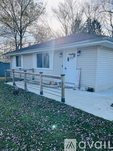 A house with a white door and a small porch.