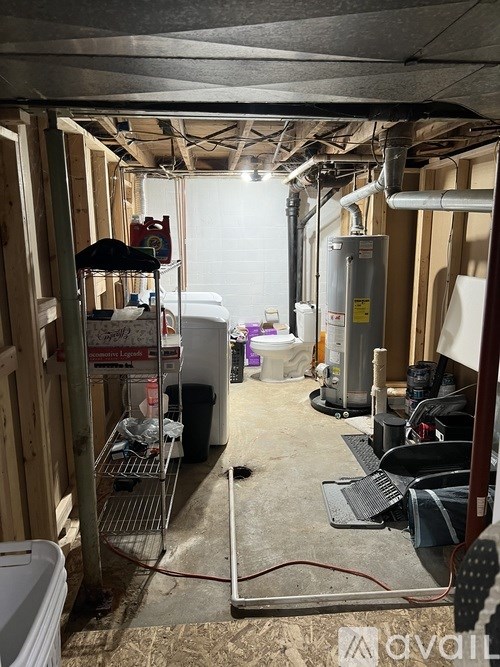 A room under construction with a lot of debris and unfinished walls.