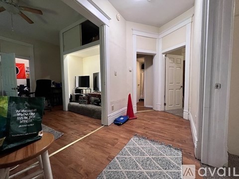 A living room with a television and a sign that says "An investment Gas with the lowest interest".