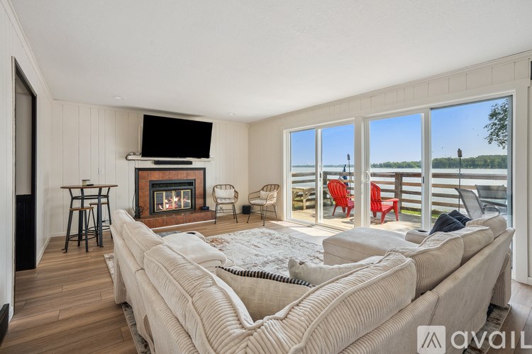 A living room with a fireplace and a large couch.