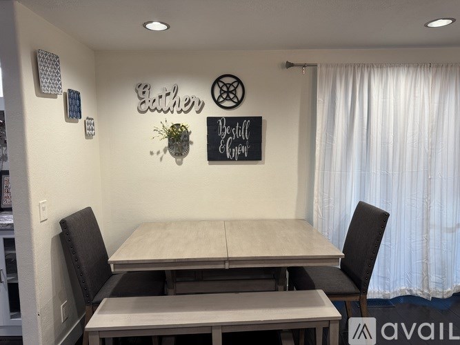 A dining room with a table and chairs and a sign that says "Eather's Pillow".