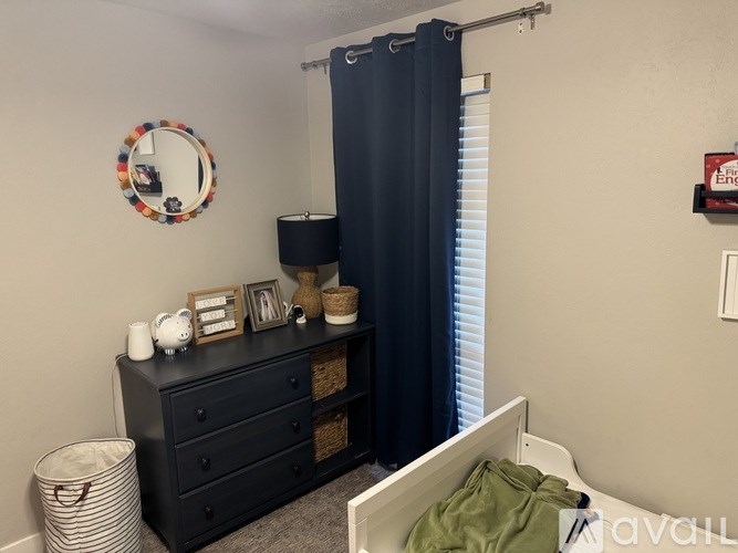 A bathroom with a black vanity and a white bathtub.