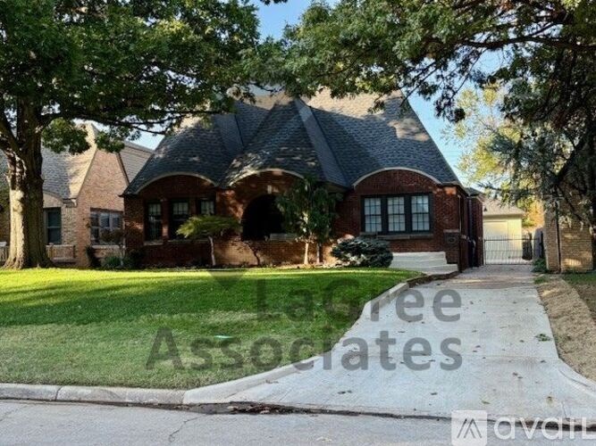 A house with a driveway in front of it.