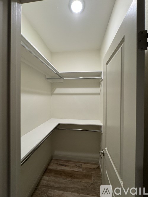 A small, empty room with a light on the ceiling.