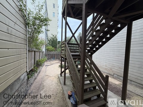 A wooden staircase leads up to a building.