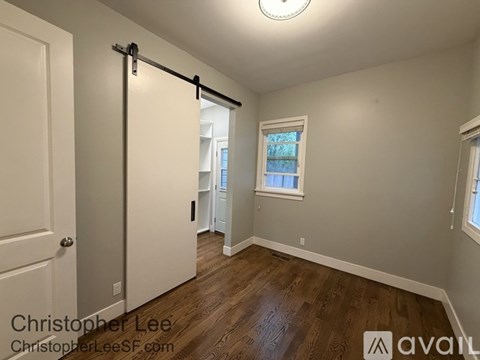 A room with a sliding door and a window.