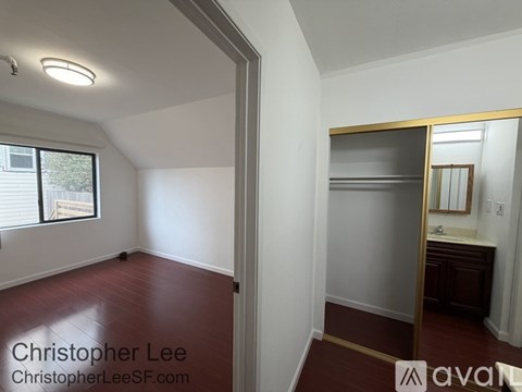 A room with a window and a sink.