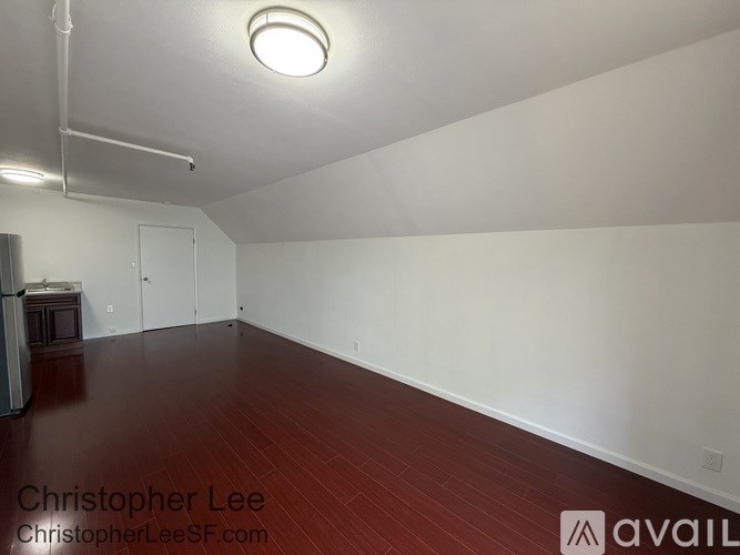 A room with wooden floors and white walls.