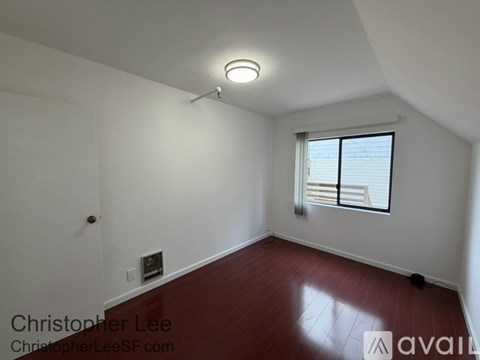 A room with a window and a door.