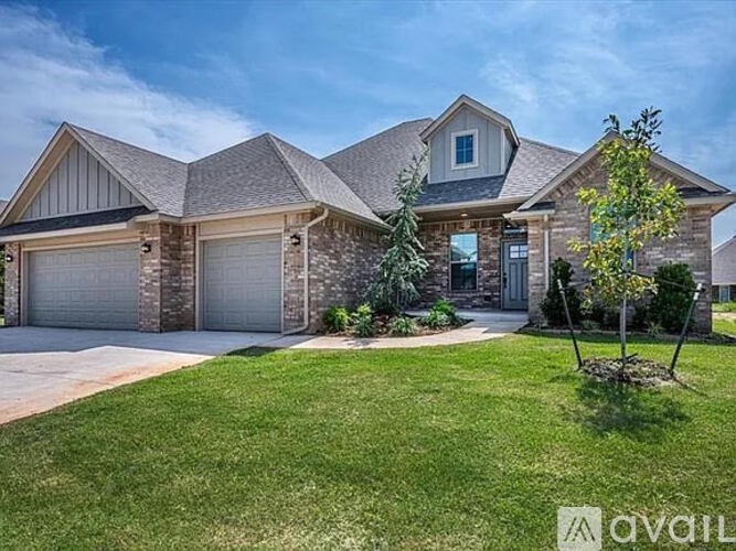 A large house with a garage and a driveway.