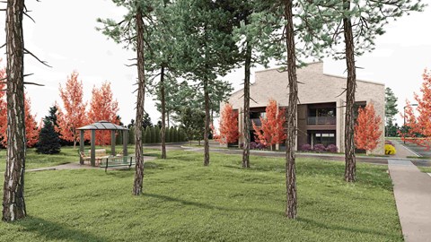 A building is surrounded by trees with red leaves.