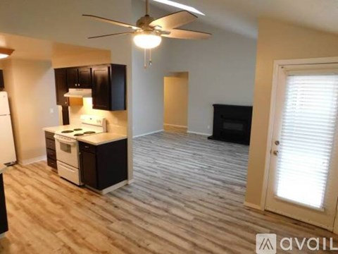 A kitchen with a refrigerator, stove, and oven is available for rent.