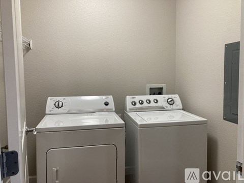 A washer and dryer in a small laundry room.