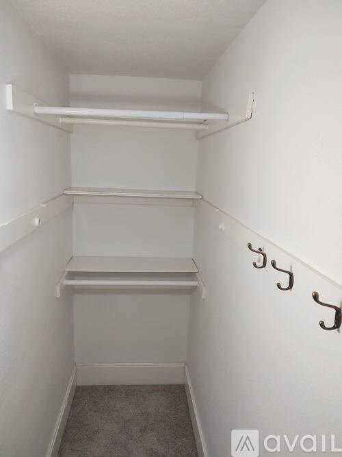 A small, empty room with a staircase on the right side.