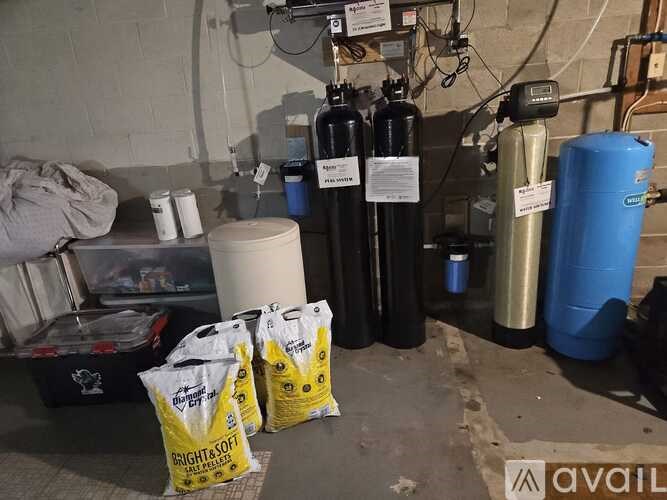 A bag of Bright & Fit is sitting on the floor next to a blue container.