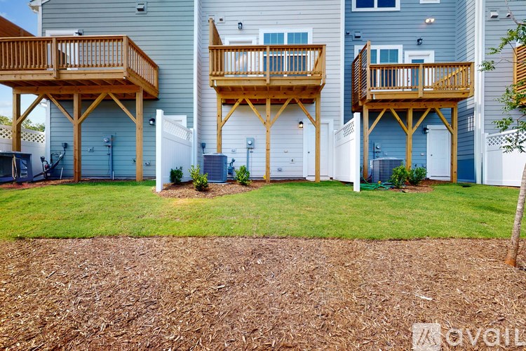 A row of houses with wooden balconies.