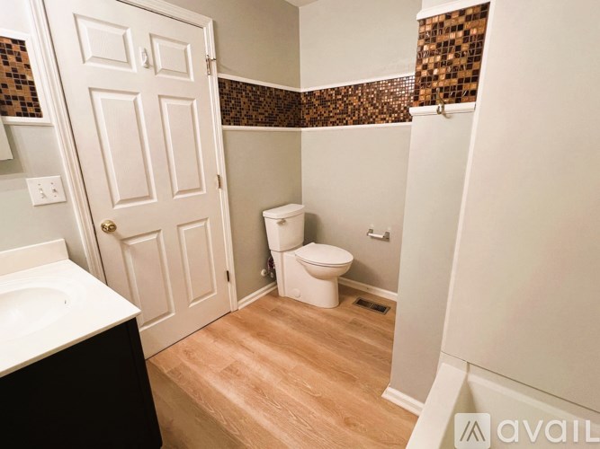 A small bathroom with a toilet and sink.