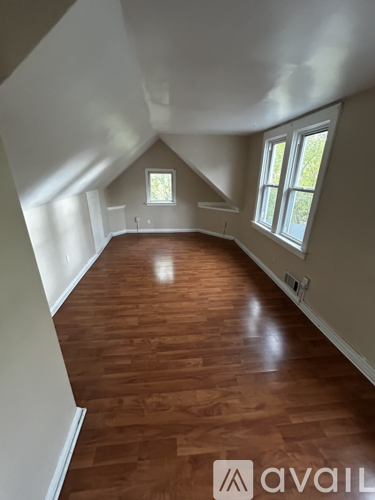A room with wooden floors and white walls.