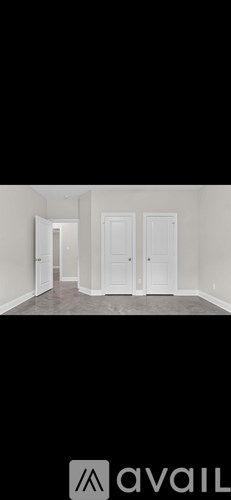 A room with a door and a wall.