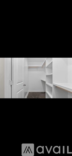 A white door with a white interior and a white shelf.